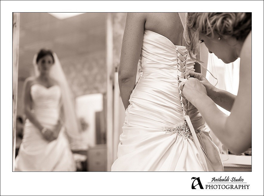 tieing dress at stone gardens bridal suite