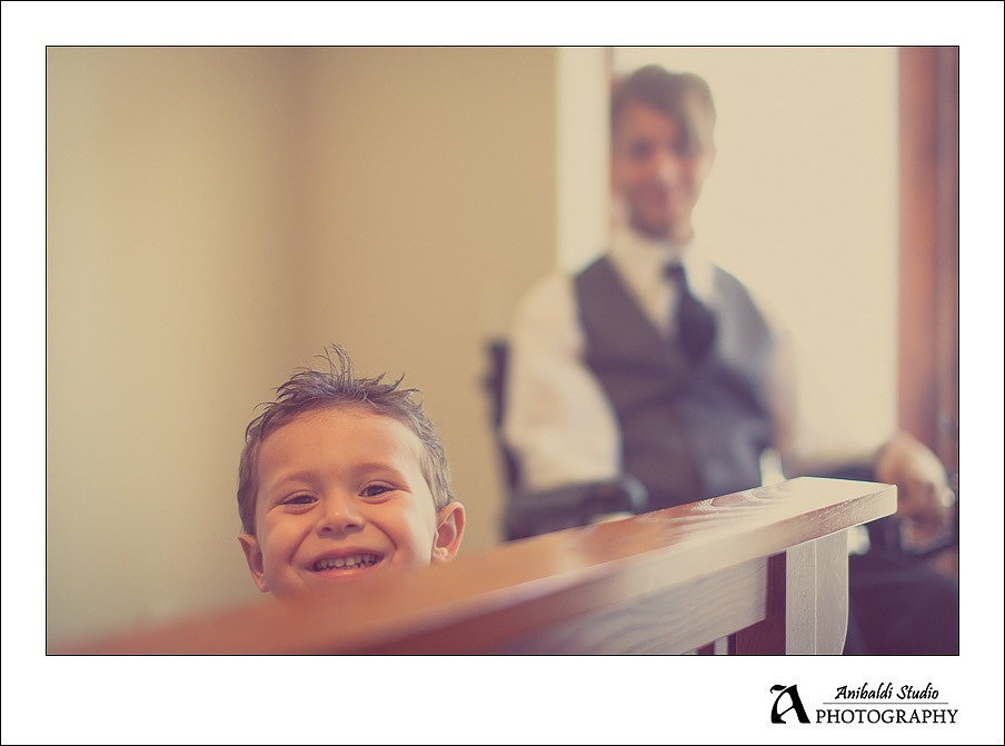 cute kid peeking at wedding