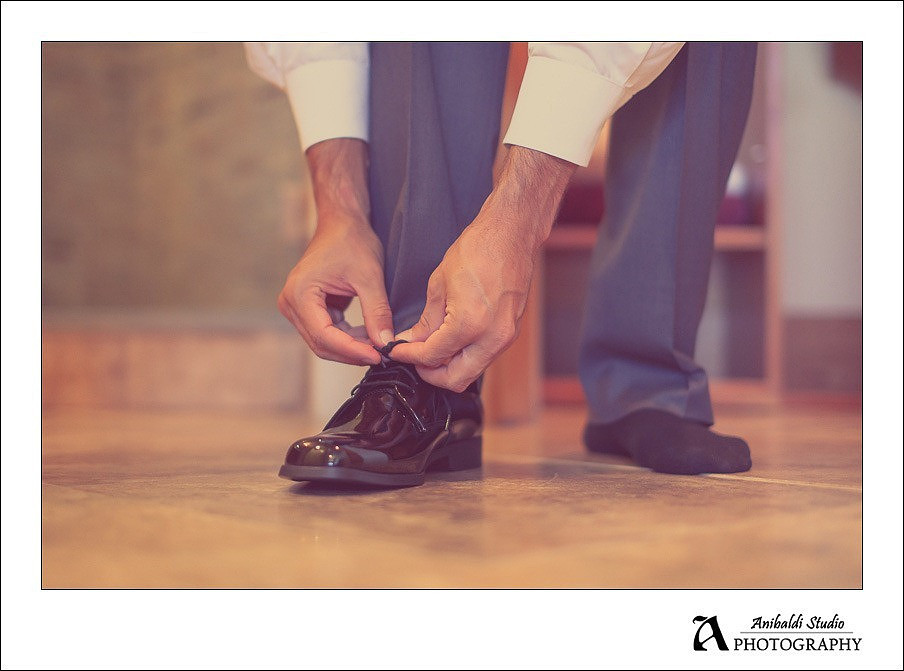 groom tieing shoe
