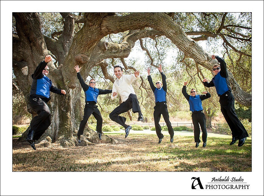 groomsmen jumping at Bates Nut Farm