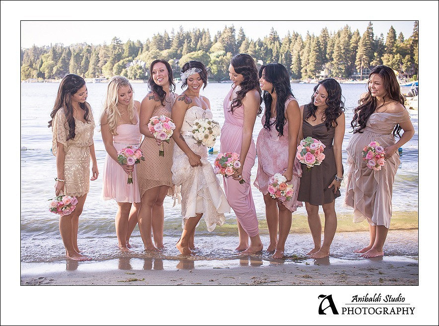 bride and bridesmaids in water