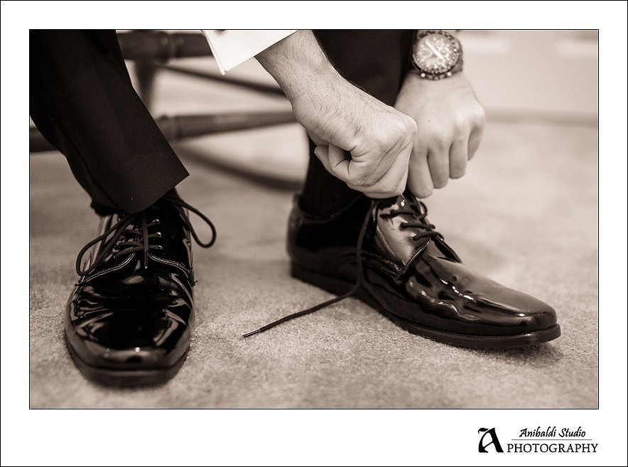 groom tieing shoe