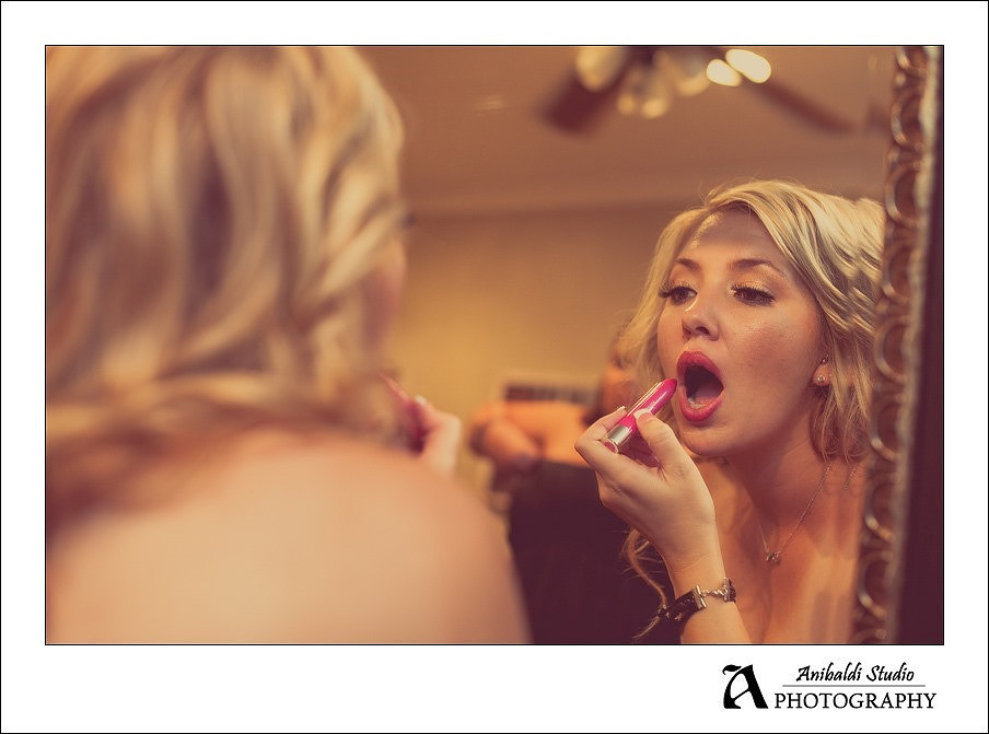 bridesmaid doing lipstick