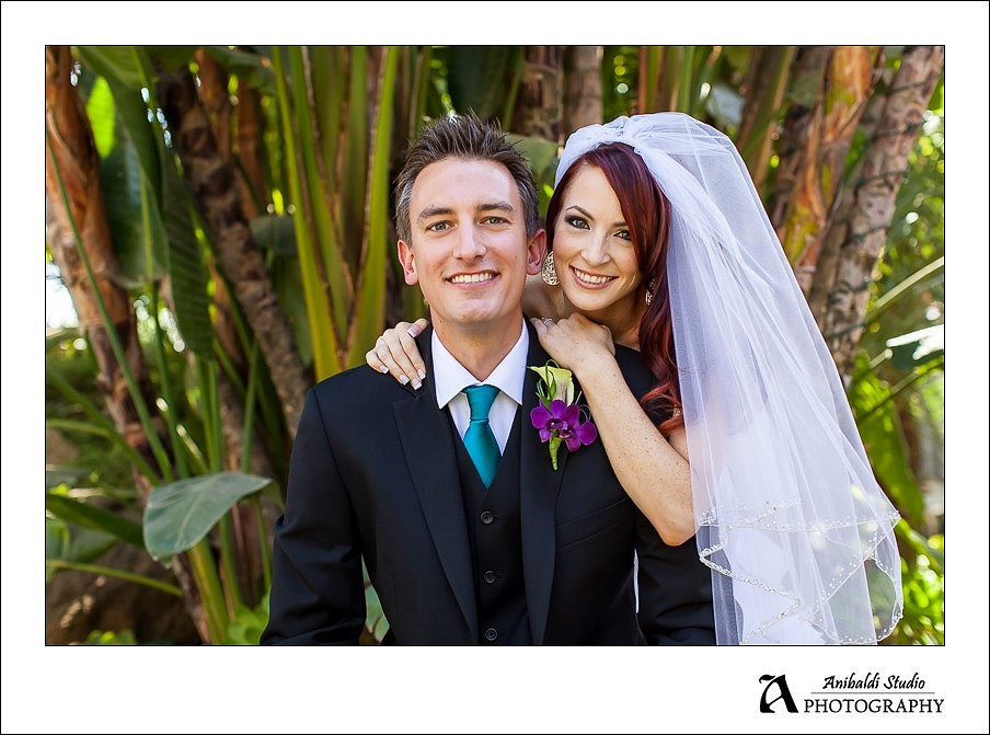 Bride and groom smile at stone gardens fallbrook