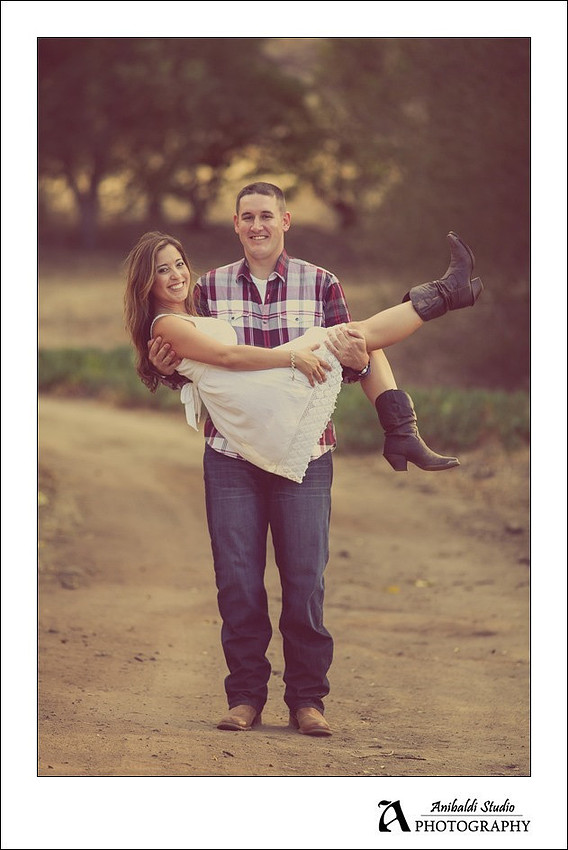 Engagement photo picking up girl in VC